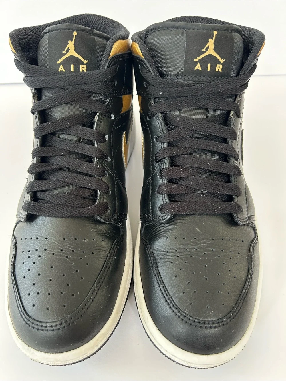 Air Jordan Black and Gold High-Top Sneakers